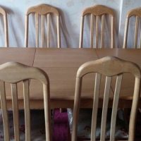 extendable dining table along with 8 chairs