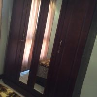 (4 door wooden cupboard w/ 2 mirrors) X 2,showroom conditon,c pics,only 1yr used.